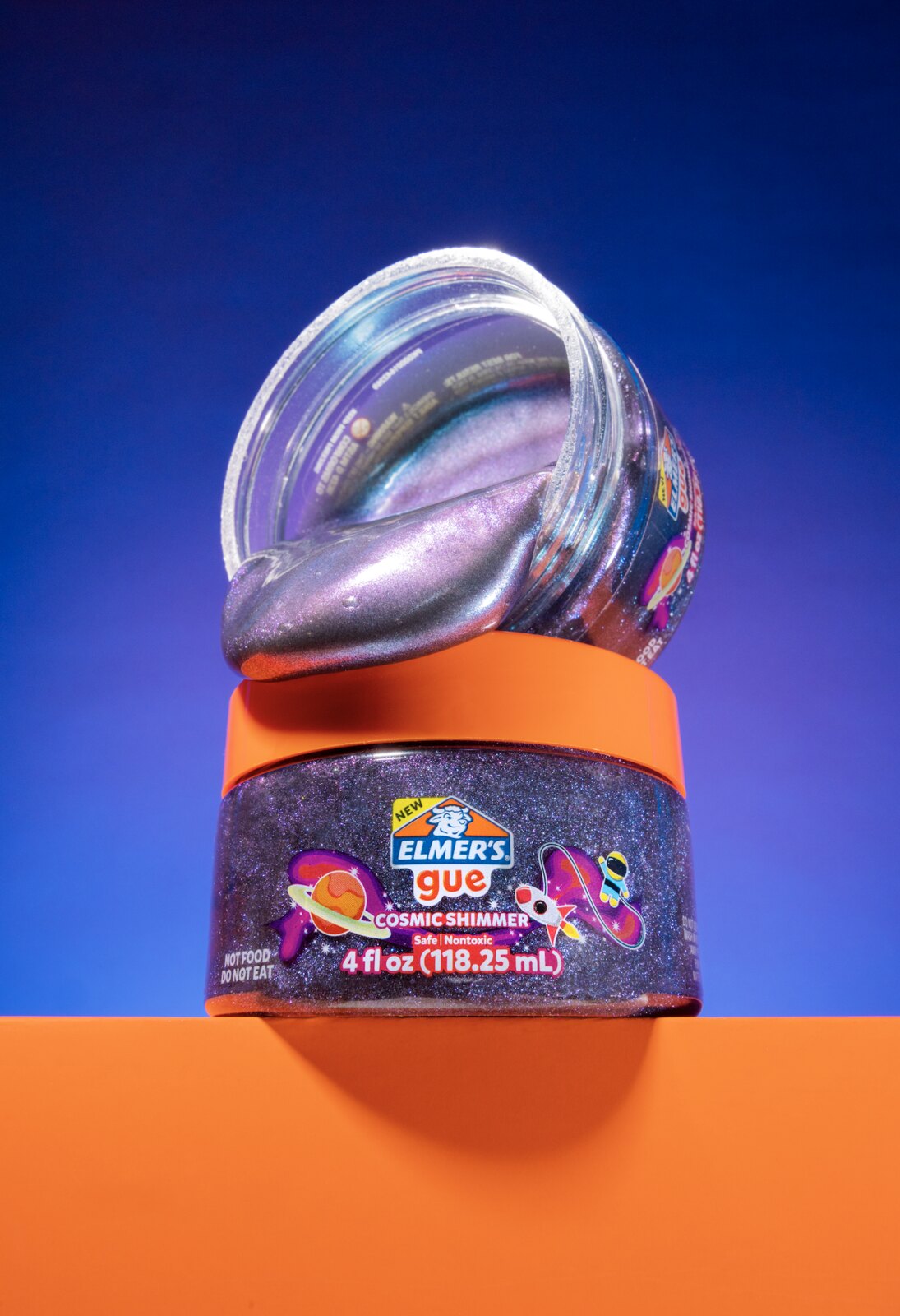 Cosmic Shimmer GUE jar on a split blue and orange background