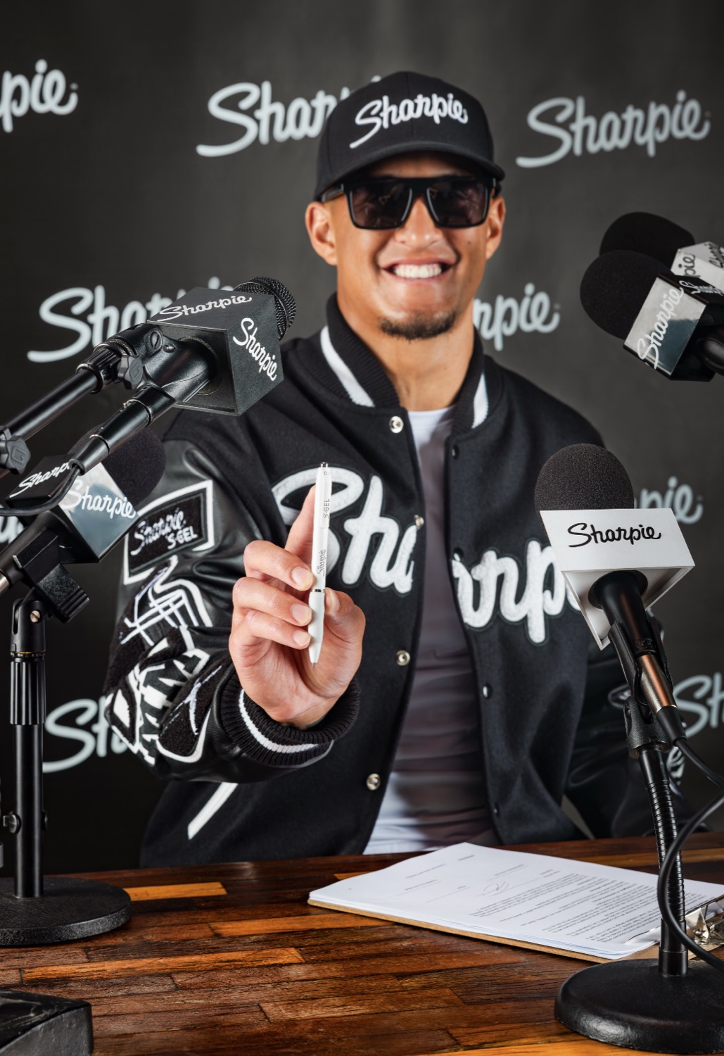 Athlete at the Sharpie press desk in a Sharpie S-Gel varsity jacket